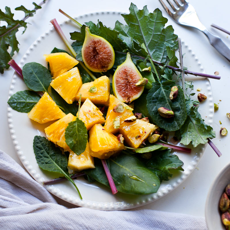 pineapple, fig and kale leaves salad with floral vinager dressing