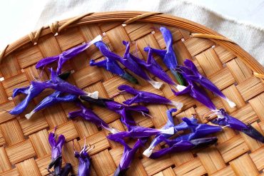 edible anise scented sage flowers on bamboo tray